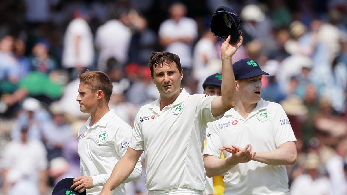Ireland’s Tim Murtagh holds up this hat to applause as he leaves the pitch after England are all out for 85 during the first day of the test match between England and Ireland at Lord’s cricket ground in London, Wednesday, July 24, 2019.