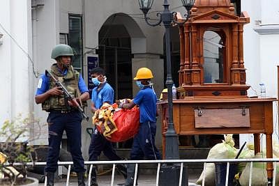 COLOMBO, April 27, 2019 (Xinhua) -- Workers clear away debris and shattered glass amid tight security outside St. Anthony
