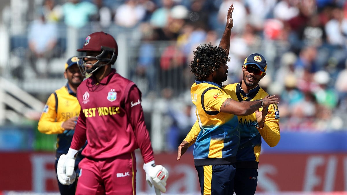 Sri Lanka’s bowler Lasith Malinga, middle, with teammate celebrates after bowling West Indies’ batsman Shai Hope during the Cricket World Cup match between Sri Lanka and the West Indies at the Riverside Ground.