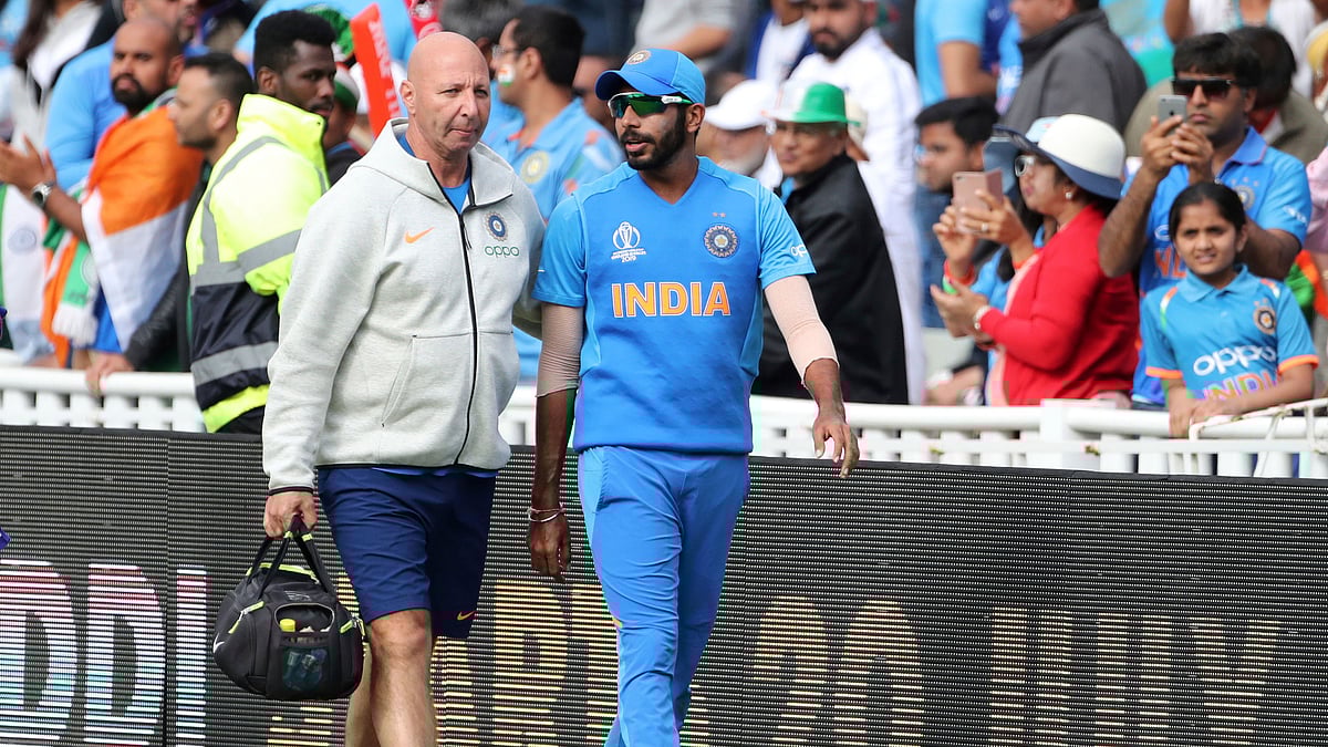 Physio Patrick Farhart with Jasprit Bumrah