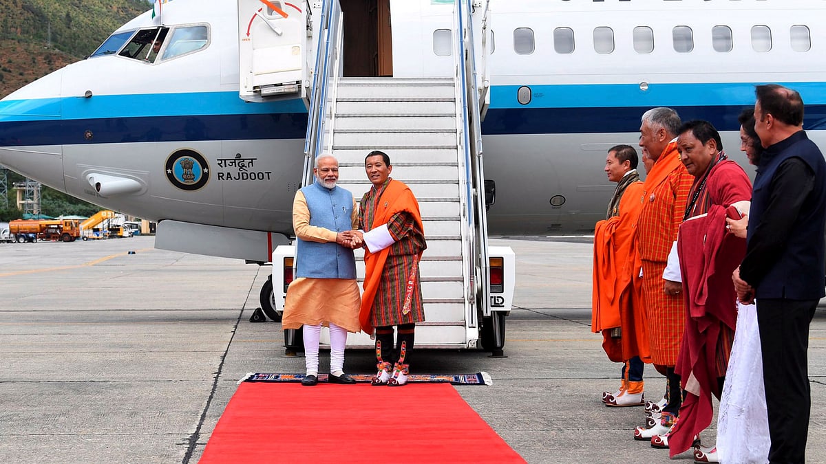 Bhutan PM Tshering receives PM Modi upon landing in Bhutan.