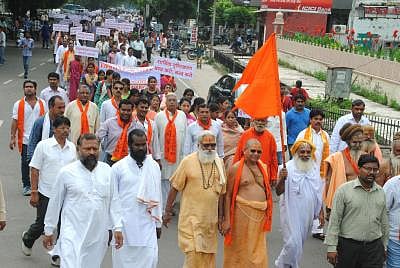 Kota, Rajasthan, India, Monday, 26 Aug, 2013, Sadhus and people partake in a Silent rally in Kota, held by Vishwa Hindu Parishad (VHP), against the ban of religious procession of 84-Kosi Parikrama in Ayodhya. ImagesMart.co/Sanjay Saini