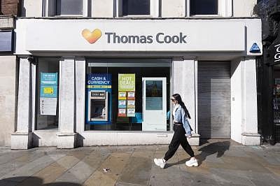 LONDON, Sept. 23, 2019 (Xinhua) -- A woman walks past a closed Thomas Cook store in London, Britain, on Sept. 23, 2019. British travel giant Thomas Cook on Monday announced its collapse after failed rescue attempts, leaving about 21,000 jobs worldwide at risk. (Photo by Ray Tang/Xinhua/IANS)