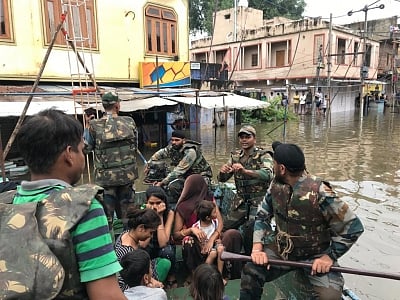 Army personnel rescue people in flood affected areas of Kota and Jhalawad.