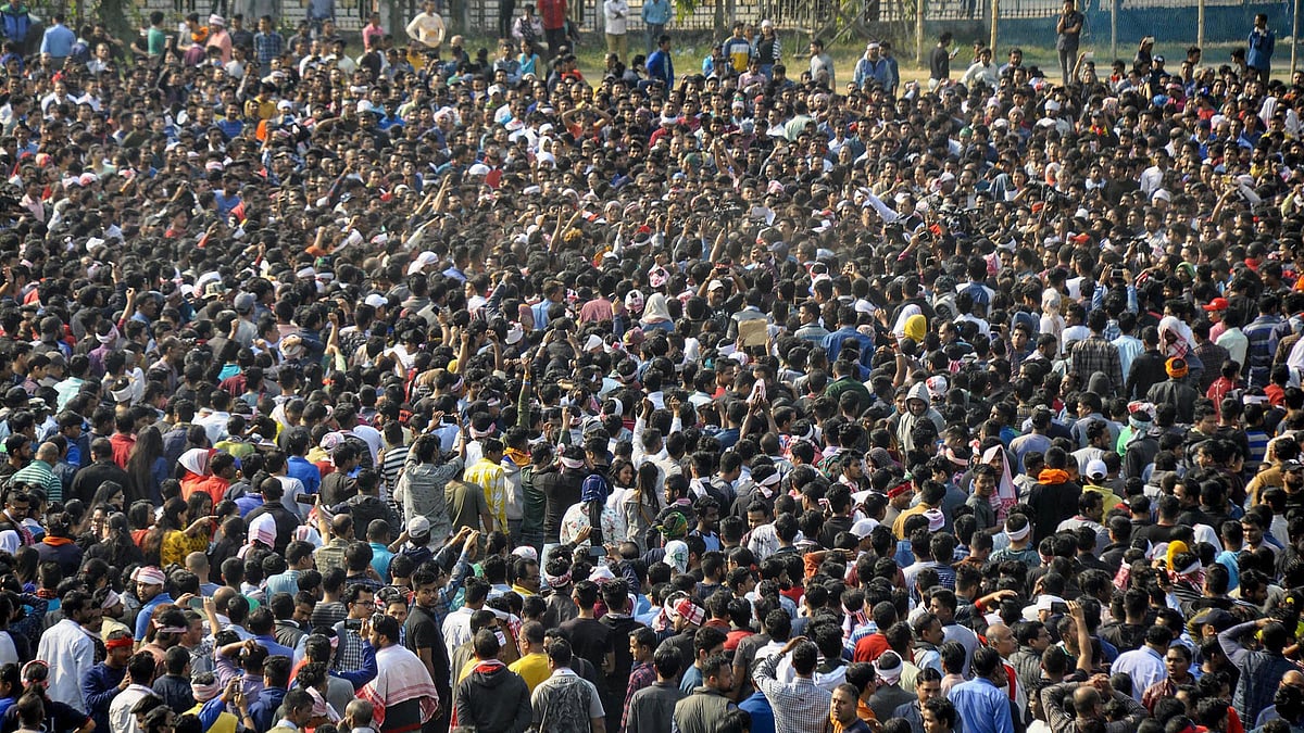 Protestors gather to defy the curfew and protest against Citizenship Amendment Act at Latasil Ground in Guwahati on Thursday.