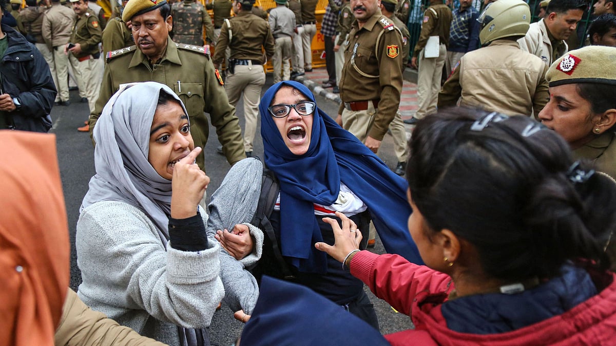 Students of Jamia Millia Islamia University stage a protest against the passing of Citizenship Amendment Act on Friday.