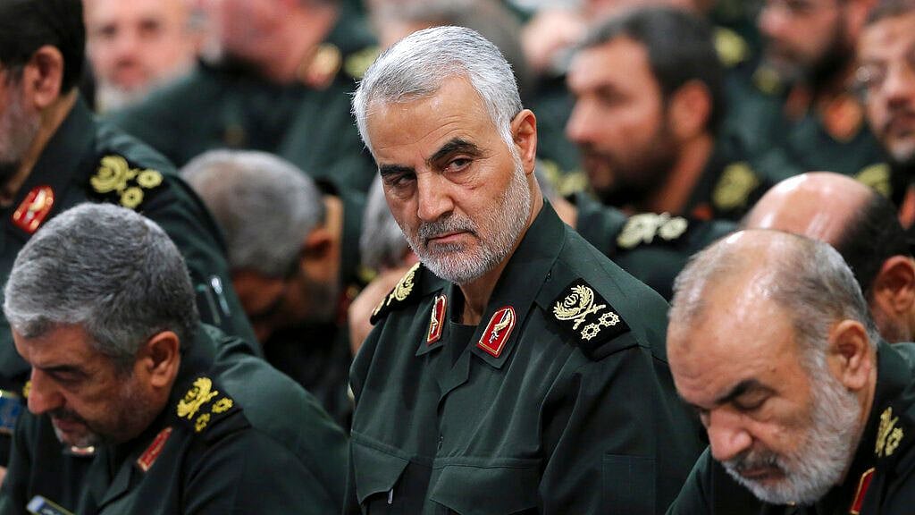 Iranian supreme leader, Revolutionary Guard Gen Qassem Soleimani, center, attends a meeting in Tehran