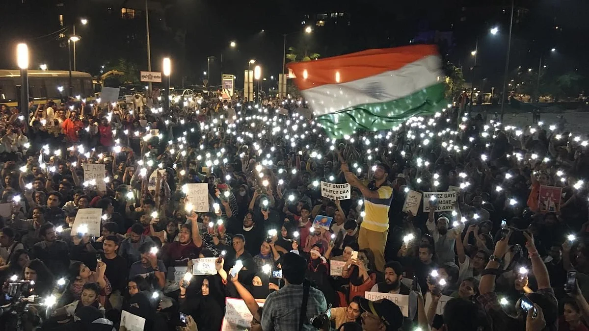 Protesters carrying the Triclour display placards and raise slogans during a rally against CAA, NRC and NPR, in Mumbai on Wednesday, 8 January.