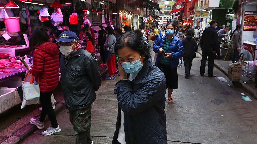 People visit the local market wearing protective face masks against the spreading coronavirus in Hong Kong, Monday,3 Feb 2020.