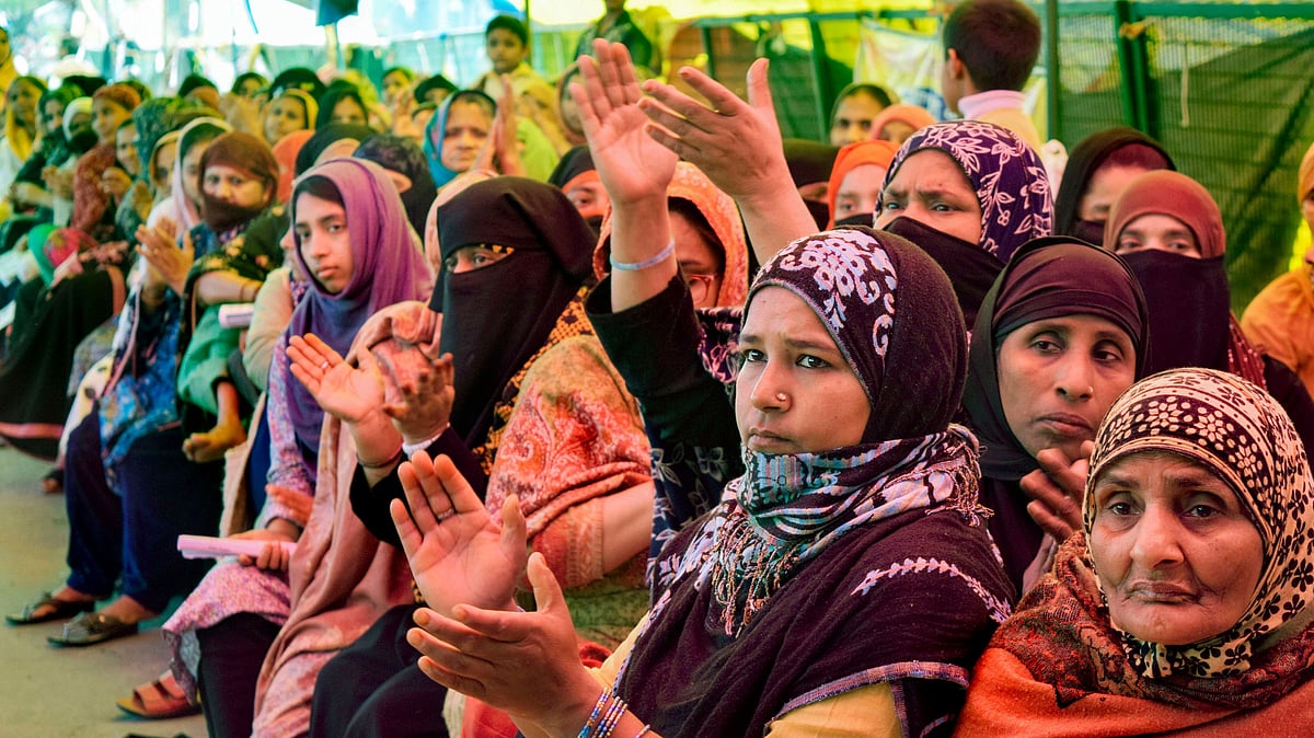 Women during a sit-in demonstration against CAA and NRC on International Women’s Day at Shaheen Bagh in New Delhi.
