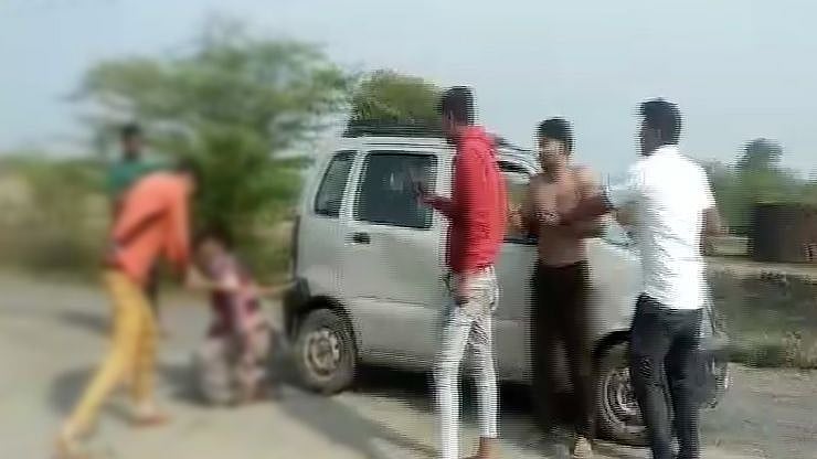 In the video, a group of men can be seen thrashing the victims.
