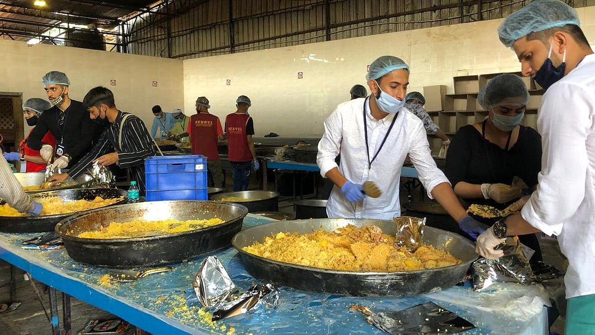Over a 100 volunteers gathered at Palace Grounds in Bengaluru to cook about 20,000 plates of biryani for distressed migrant workers.