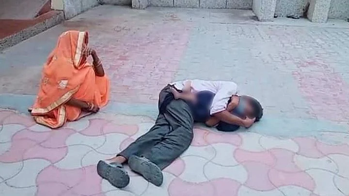 Parents cling to the body of their one-year-old boy, and weep inconsolably inside a government hospital complex in UP.