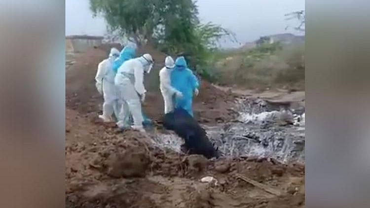 “Let us put it in one hole and close it. Put it slowly,” says one man heard in the video.