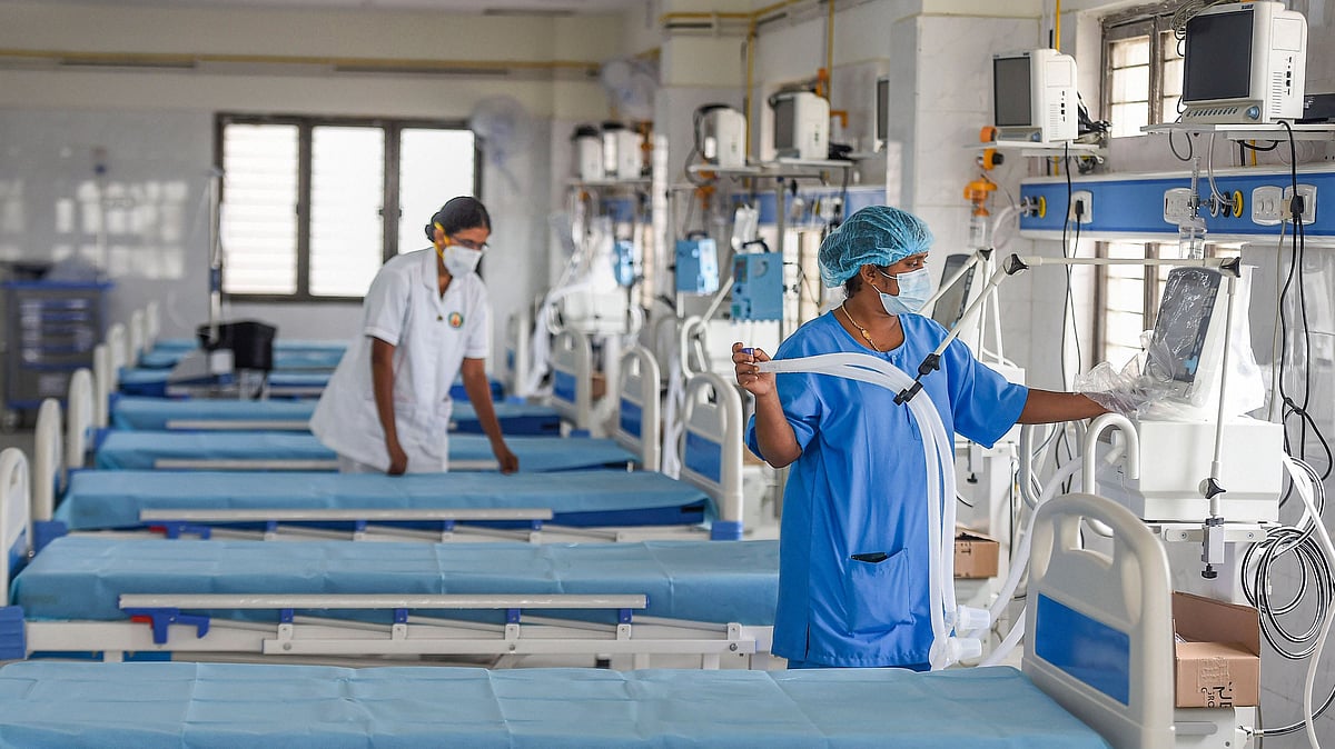  A technician works to convert a building of the National Institute of Ageing into a dedicated COVID-19 care centre in Chennai on 6 July.