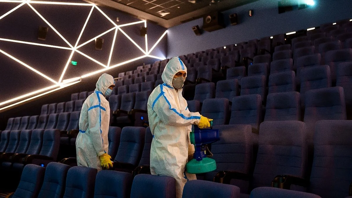 A movie theatre getting sanitised.