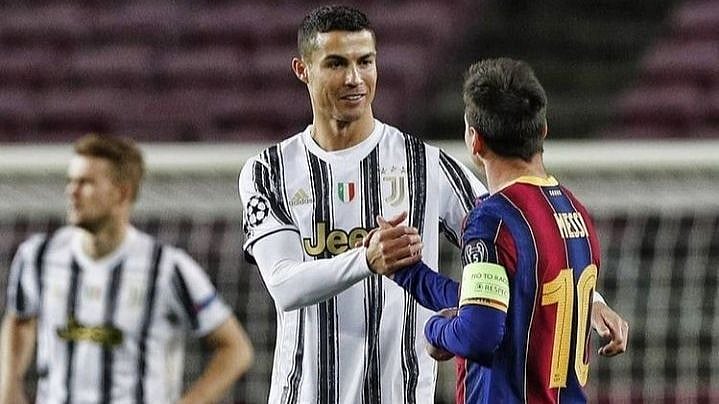 Cristiano Ronaldo and Lionel Messi share a light moment. 