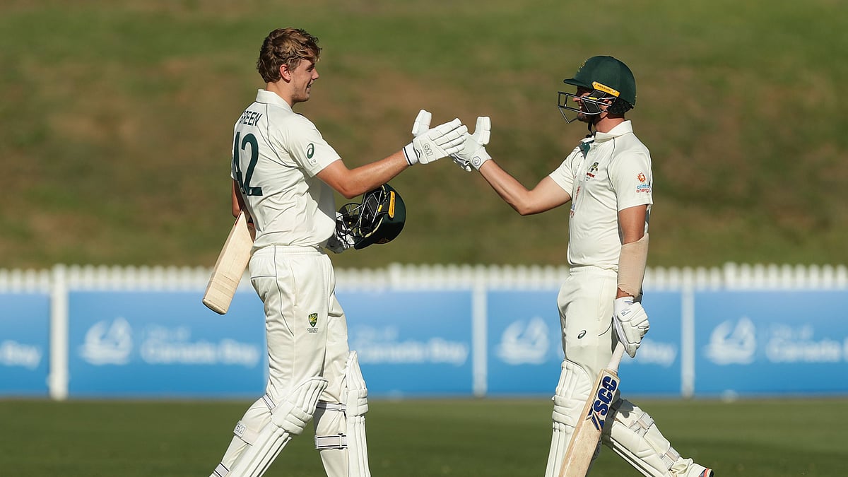Cameron Green celebrates scoring a century against India A