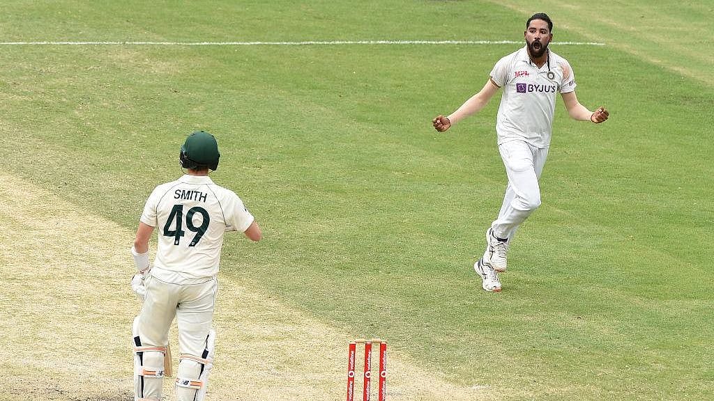 Mohammed Siraj celebrates the wicket of Steve Smith on Day 4 at the Gabba.&nbsp;