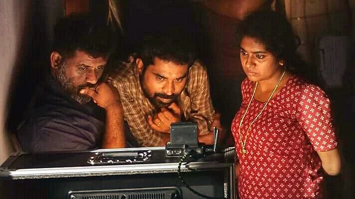 Jeo Baby, Suraj Venjaramoodu and Nimisha Sajayan on the sets of <i>The Great Indian Kitchen.</i>