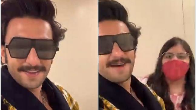 <p>Ranveer Singh in the video with a fan singing the 'pawri' meme</p>