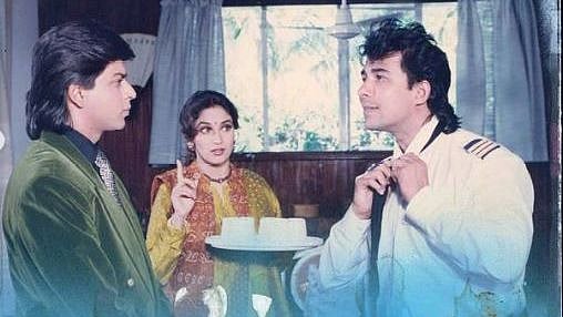 <div class="paragraphs"><p>Shah Rukh Khan, Madhuri Dixit, and Deepak Tijori in 'Anjaam'</p></div>
