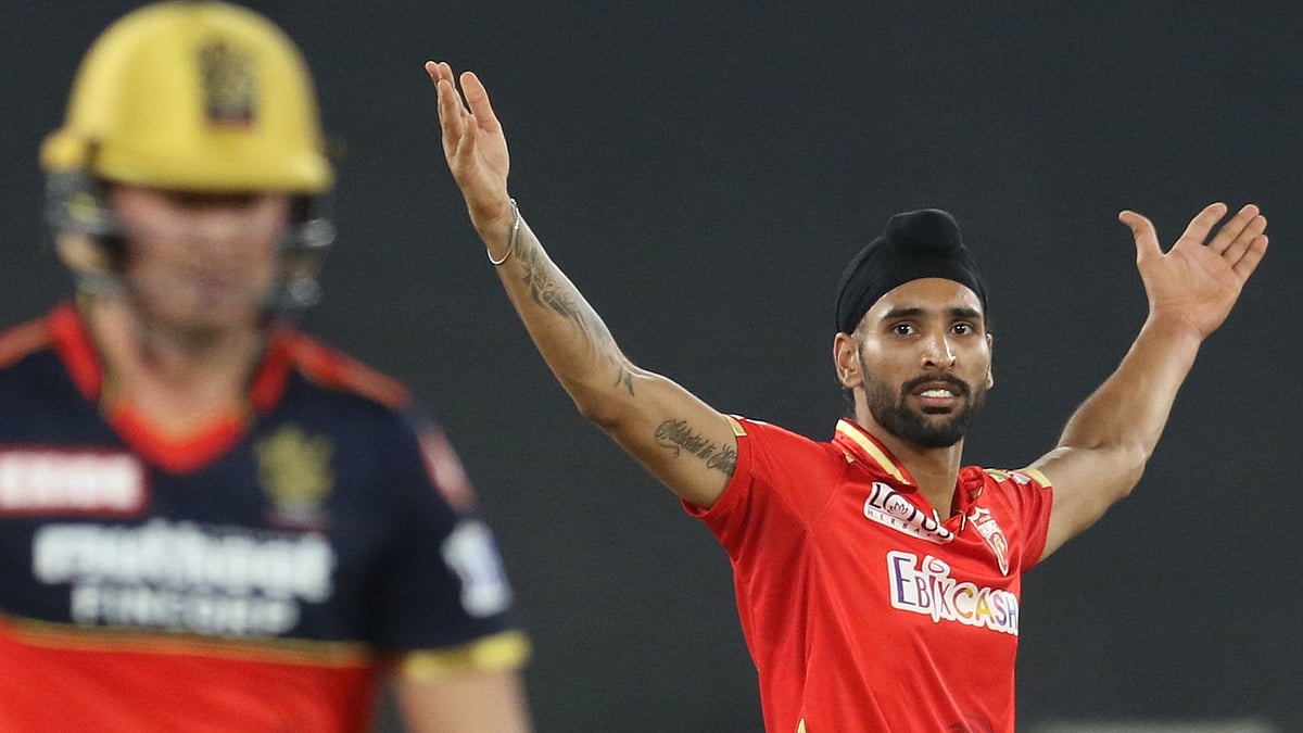 Harpreet Brar celebrates the wicket of AB de Villiers.