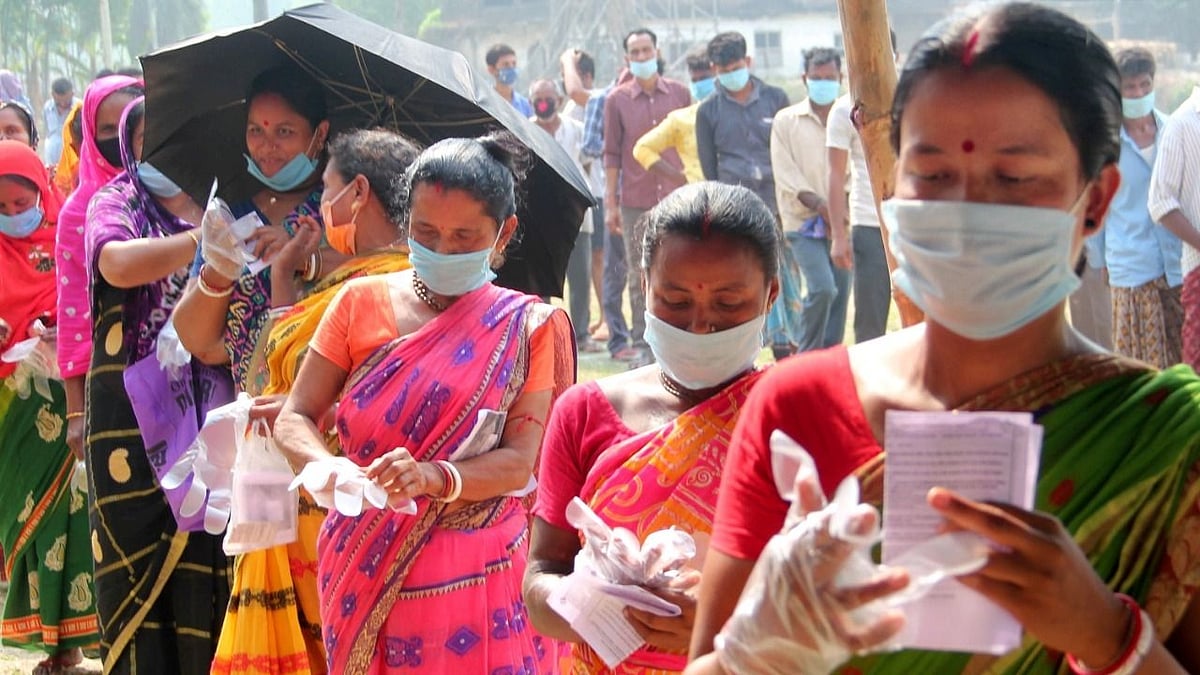 People queue up outside a polling station at a village near Balurghat in South Dinajpur district during the seventh phase of West Bengal Assembly elections on Thursday, 29 April. Image used for representational purposes.&nbsp;