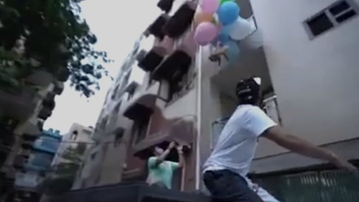 <div class="paragraphs"><p>YouTuber Gaurav Sharma making his dog float by tying it to balloons.</p></div>