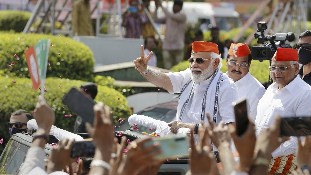 <div class="paragraphs"><p>Prime Minister Narendra Modi flashes the victory sign during a roadshow after BJPs victory in the recent Assembly polls, in Ahmedabad.</p></div>