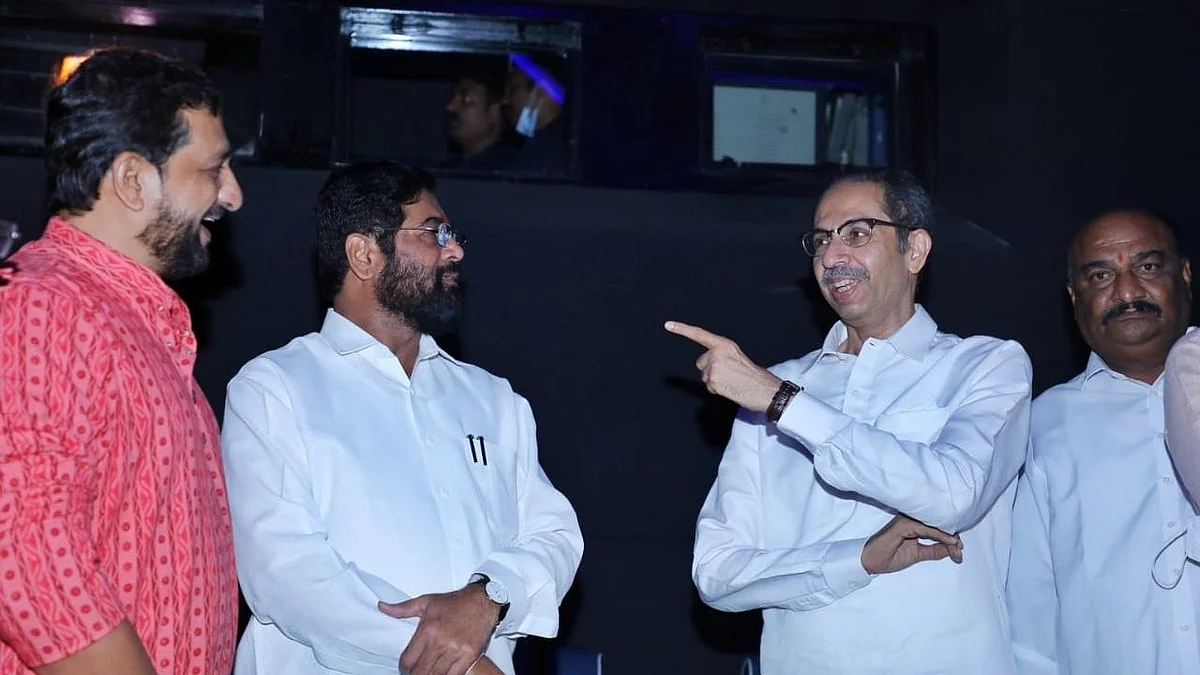 <div class="paragraphs"><p>Eknath Shinde with Uddhav Thackeray.</p></div>