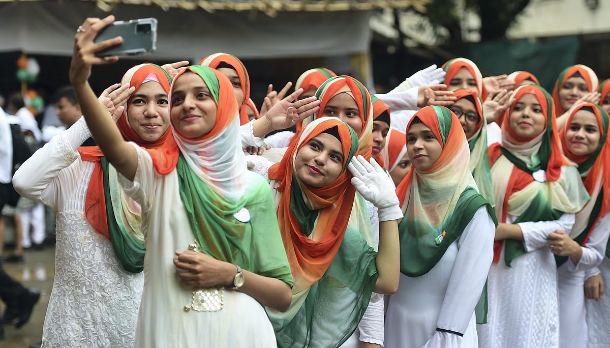<div class="paragraphs"><p>Students of Anjuman Islam College wearing tricoloured hijab take a selfie during a cultural programme organised on the occasion of 76th Independence Day, in Mumbai, Monday, Aug. 15, 2022.</p></div>