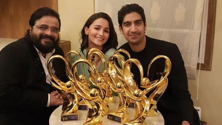 <div class="paragraphs"><p>Alia Bhatt poses with filmmaker Ayan Mukerji and musician Pritam.</p></div>