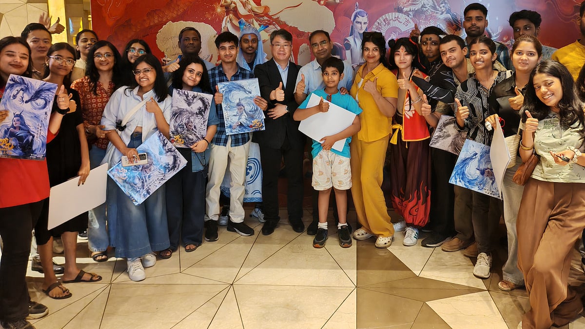 <div class="paragraphs"><p>Indian media representatives and university students pose in front of the poster of Chinese animated movie <em>Nezha 2</em> during a screening event hosted by the Chinese Embassy in India, May 10, 2025.</p></div>