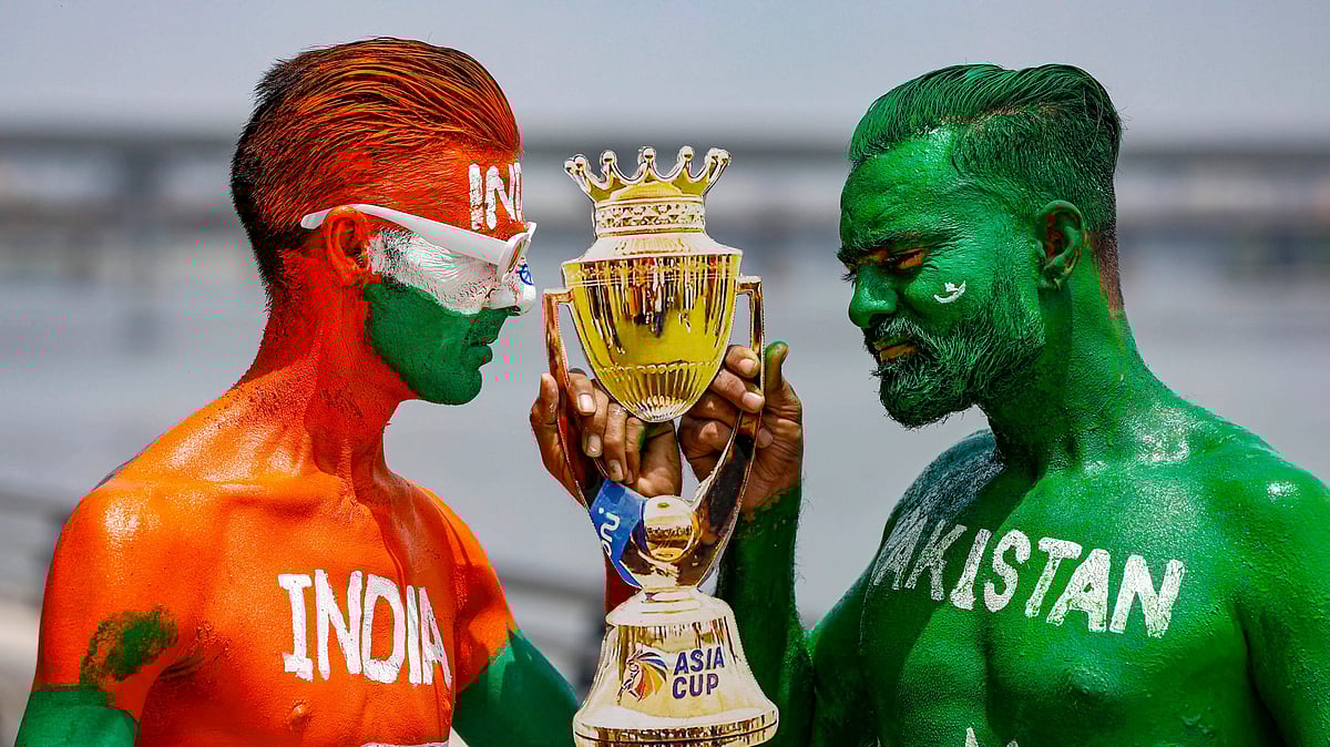 <div class="paragraphs"><p>Cricket fans, with their faces painted in the Indian and Pakistani national flags colours, pose for photographs ahead of the Asia Cup match between India and Pakistan in Ahmedabad on Friday, 1 September.</p></div>