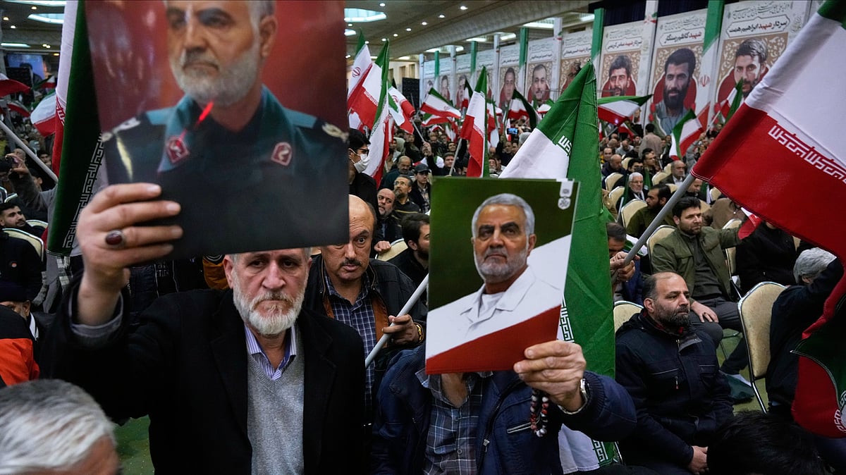 <div class="paragraphs"><p>Two men hold up posters of the late commander of Irans Revolutionary Guard expeditionary Quds Force, Gen. Qassem Soleimani, who was killed in a U.S. drone attack in 2020 in Iraq, during a ceremony commemorating his death anniversary at the Imam Khomeini grand mosque in Tehran, Iran, Thursday, Jan. 1, 2026</p></div>