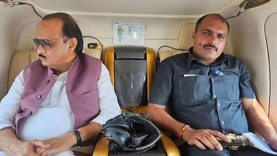 <div class="paragraphs"><p>Vipin Jadhav travelling with Ajit Pawar.&nbsp;</p></div>