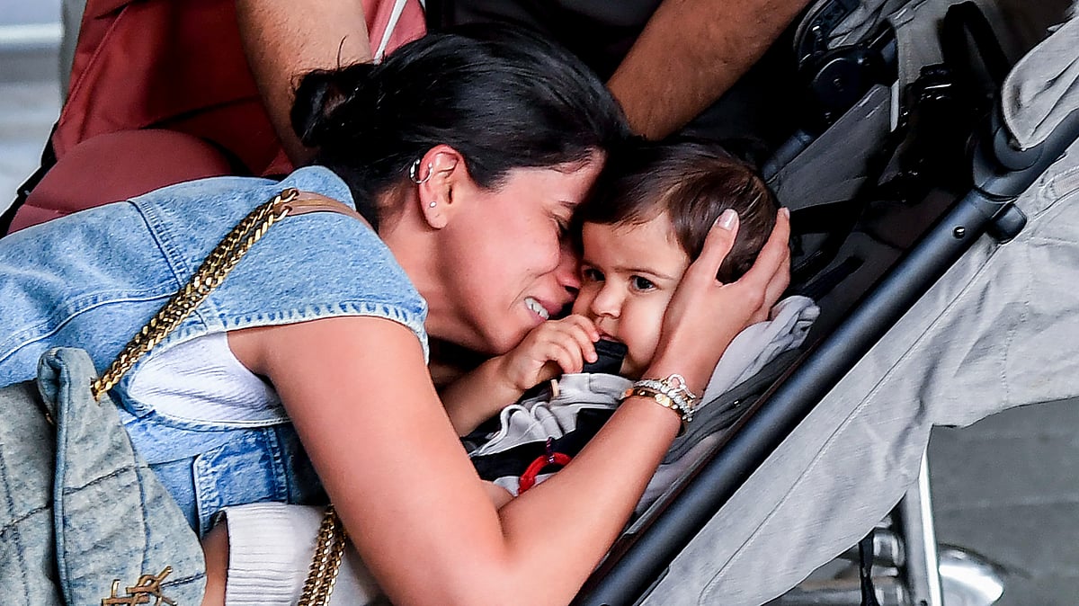 <div class="paragraphs"><p>A woman reacts on meeting her husband, unseen, and one of the twin infants upon their arrival from Abu Dhabi at the Chhatrapati Shivaji Maharaj International Airport amid disruptions to flight services caused by escalating conflict in the Middle East, in Mumbai, Tuesday, March 3, 2026.</p></div>
