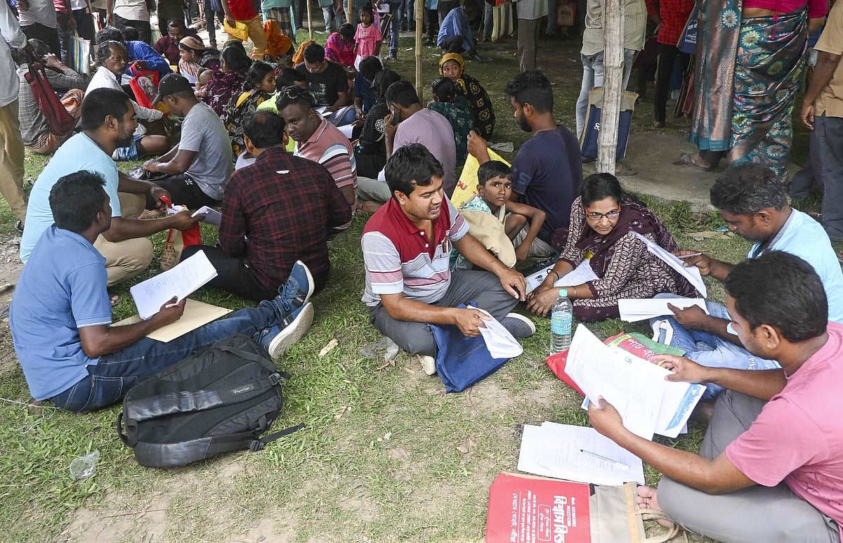 <div class="paragraphs"><p>People whose names were deleted from voter lists during the ongoing Special Intensive Revision (SIR) of electoral rolls in poll-bound West Bengal queue up before judicial officers to present their cases ahead of the state Assembly elections in Krishnanagar, Nadia.</p></div>
