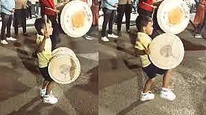 boy playing dhol