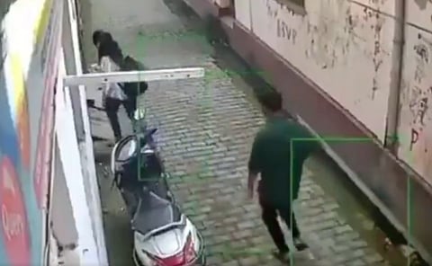 Young man chases teenage girl