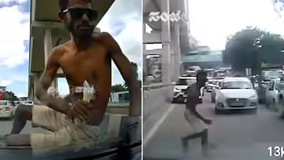 young man jumping onto the bonnet of a car