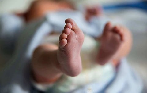 Baby fell from mother's arms into a well while she was drawing water