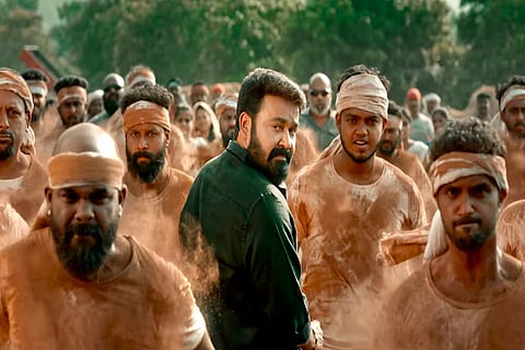 Mohanlal is seen in a black shirt and veshti in the teaser of 'Aaraattu'. 