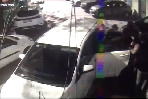 CCTV footage showing the unidentified accused seemingly forcing people into a car