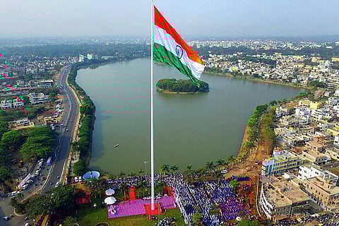 An aerial view of Belgavi with an Indian flag flying