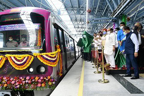 Basavaraj Bommai and Hardeep Singh Puri flaffing off the metro train