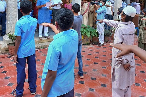 Students in Bengaluru, one of them wearing skull cap: Karnataka student beaten allegedly for wearing skull cap, SI, college principal booked