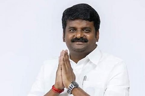 Ex-Health Min Vijayabaskar with his hands folded for photo. 