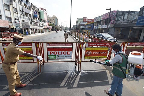 The sanitation worker sprays disinfectants during the lockdown to curb spread of coronavirus in Chennai